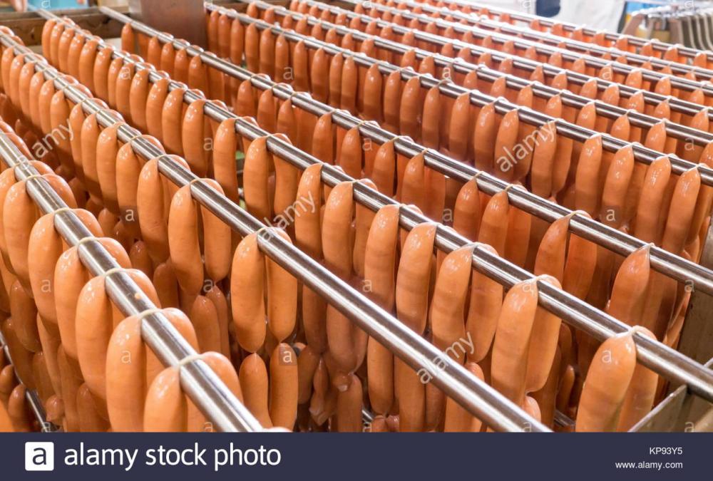 freshly-produced-pork-hotdogs-and-sausages-in-a-factory-ready-for-KP93Y5.jpg